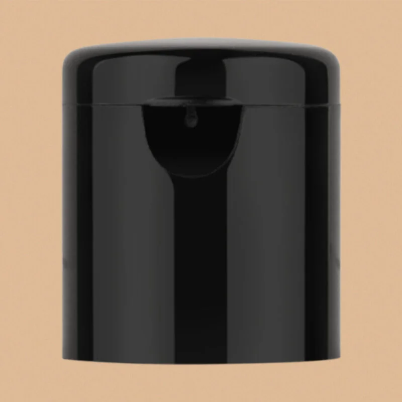 Black long fliptop cap for bottles on a neutral background.
