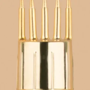 Close-up of a premium golden coated metal comb cap with five polished tines.