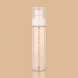 Clear cylindrical plastic spray bottle with a white pump and transparent cap.