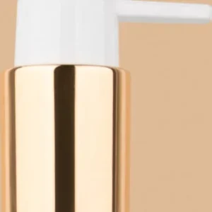 White and gold dispenser pump for bottles.