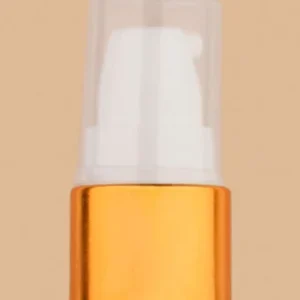 White and golden cream pump bottle dispenser.