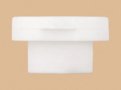 White T-shape flip-top cap for bottles and containers.